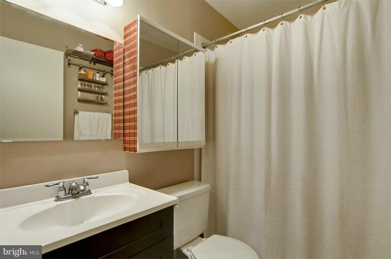 2038 Swans Neck Way Reston, VA 20191 - Photo 3 of 27 a bathroom with a sink and a mirror