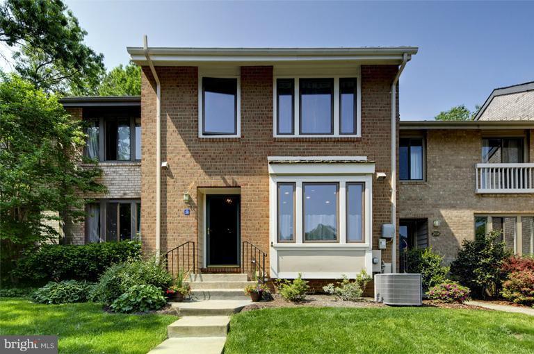 2038 Swans Neck Way Reston, VA 20191 - Photo 27 of 27 a front view of a house with garden