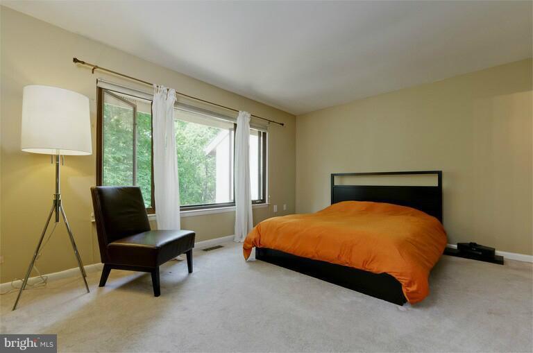 2038 Swans Neck Way Reston, VA 20191 - Photo 6 of 27 a bedroom with a bed and window