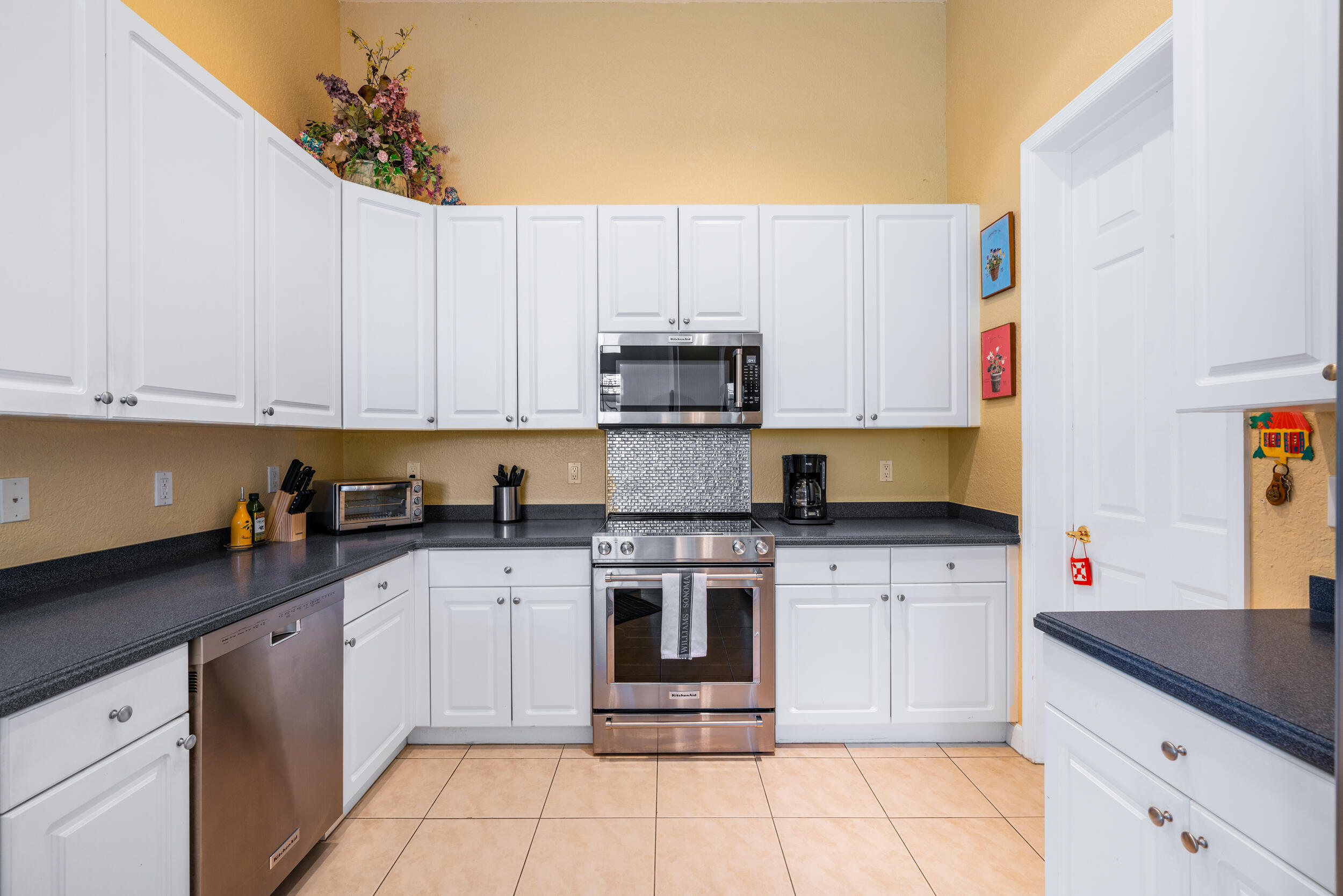 108 Palmfield Way Jupiter, FL 33458 - Photo 12 of 30 a kitchen with cabinets and appliances