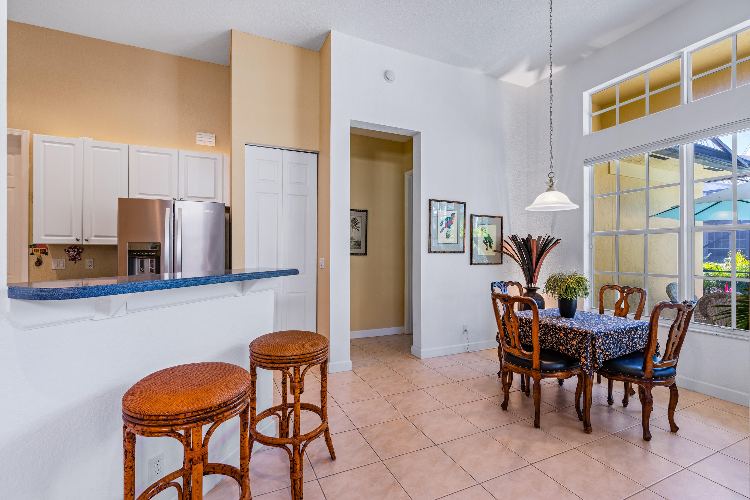 108 Palmfield Way Jupiter, FL 33458 - Photo 14 of 30 a view of a dining room with furniture and chandelier
