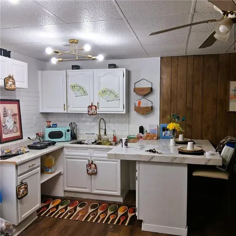 a kitchen that has a sink and a stove in it