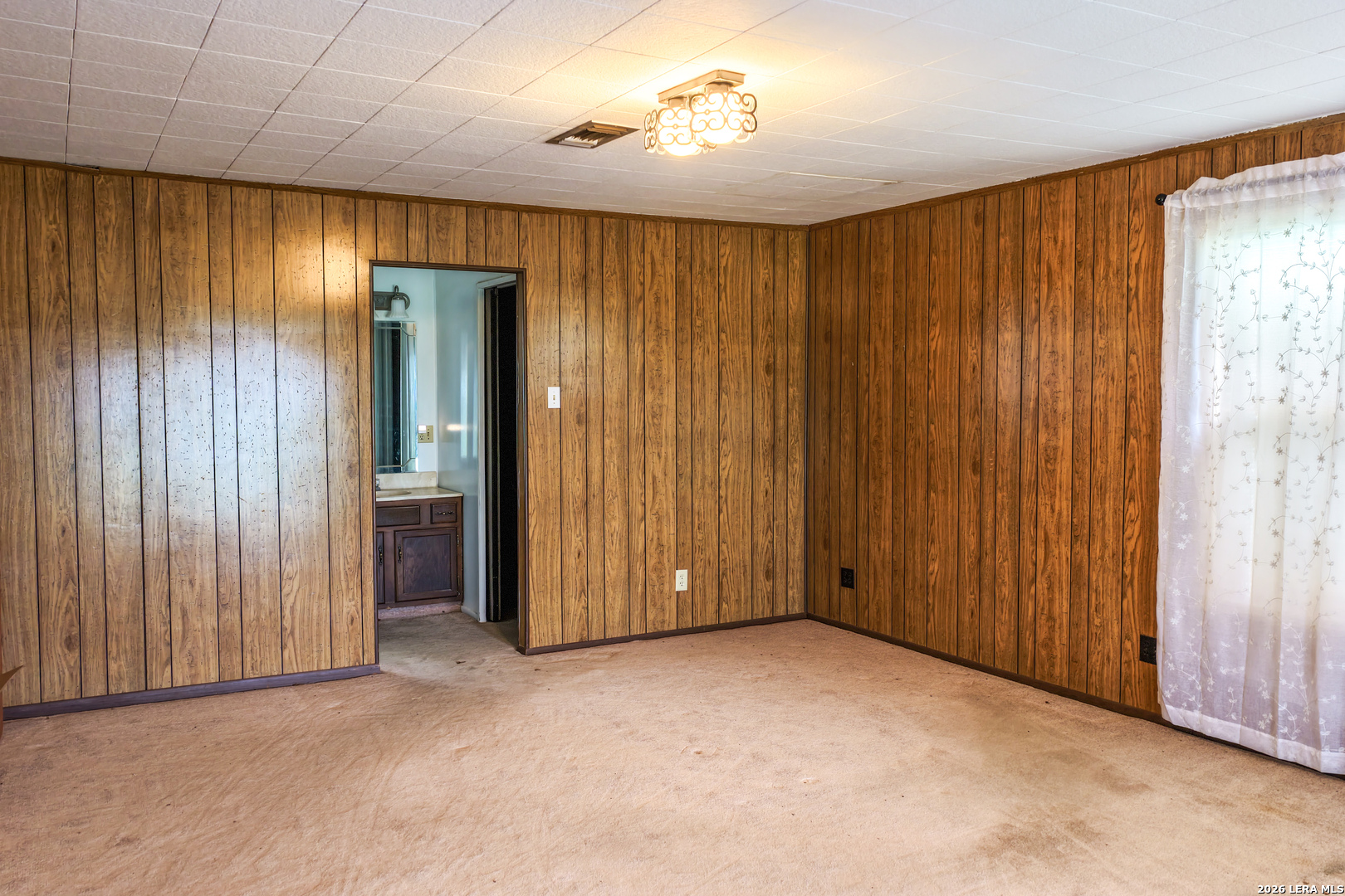 430 Watts Road Kingsbury, TX 78638 - Photo 33 of 37 an empty room with windows chandelier