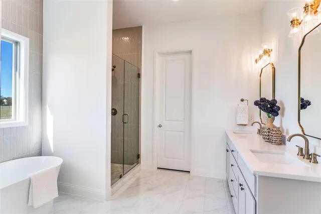 a bathroom with a double vanity sink a toilet and a mirror
