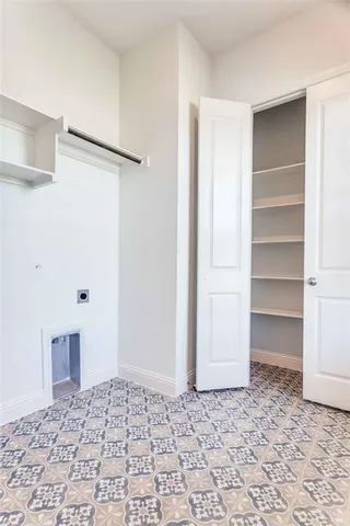 a view of empty room with a fireplace