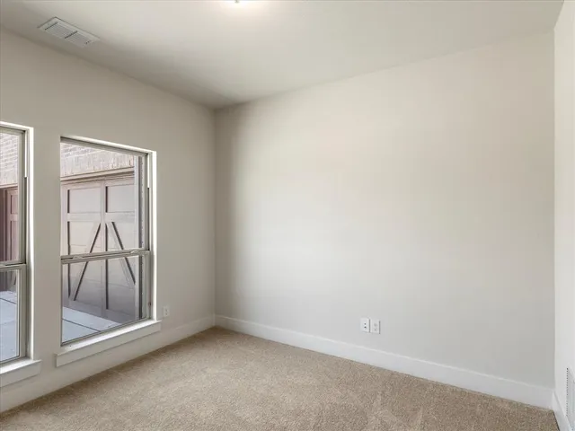 an empty room with mirror