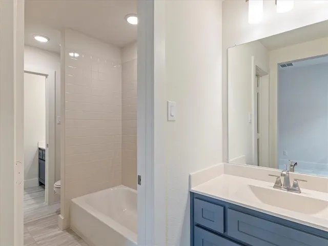 a bathroom with a sink and a bathtub
