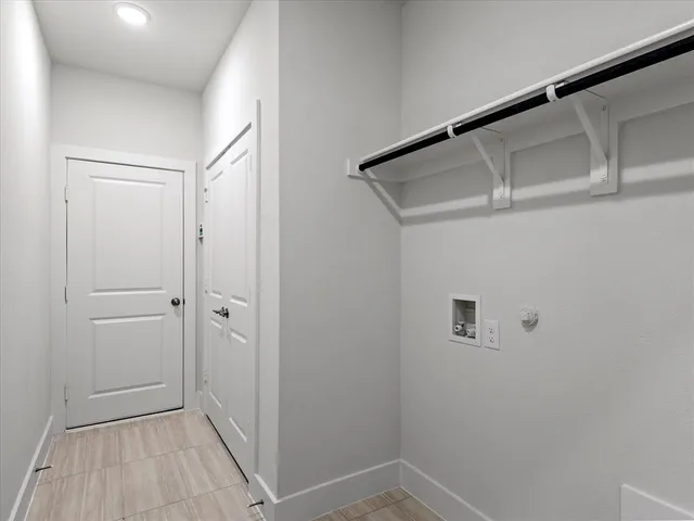 a view of a livingroom with furniture and windows