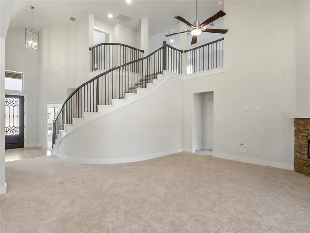 a view of staircase with white walls