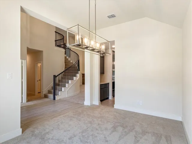 a view of a livingroom with stairs