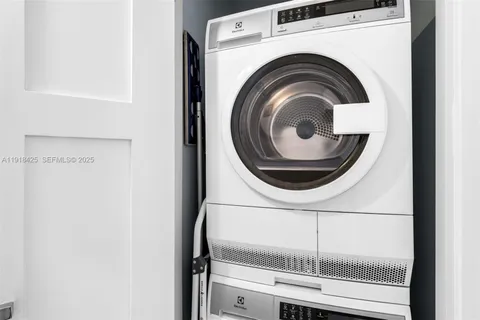 a close view of a utility room with dryer and washer