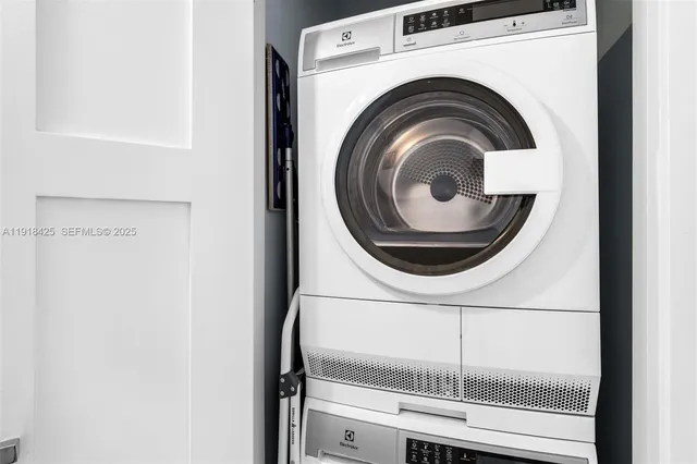 a close view of a utility room with dryer and washer