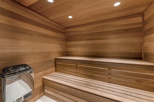 a view of a swimming pool with a table and chairs