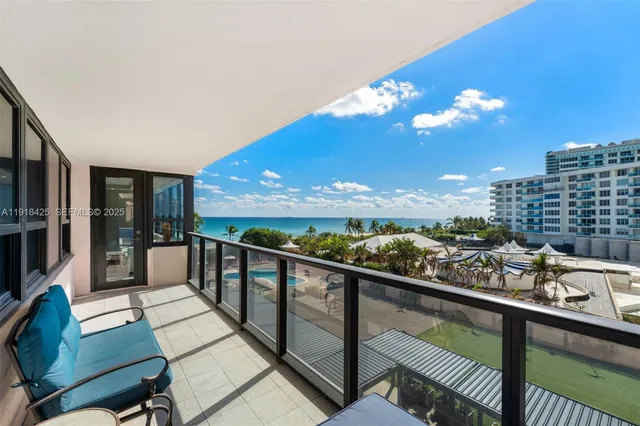 a view of a balcony with chairs