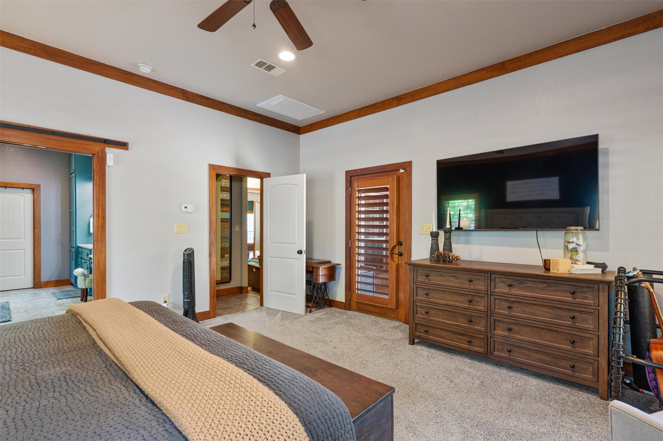 200 Little River Road Liberty Hill, TX 78642 - Photo 18 of 40 a bedroom with a bed and a flat screen tv