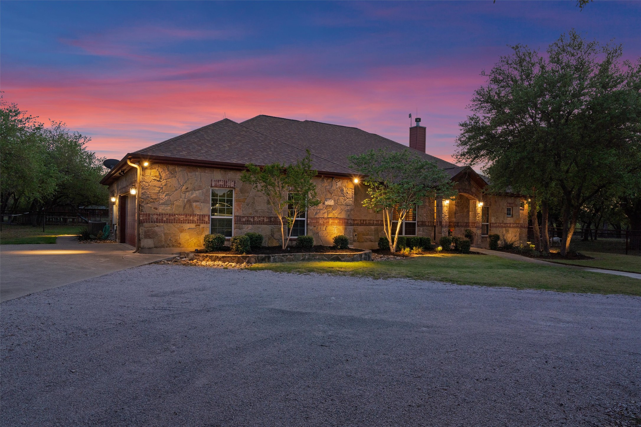 200 Little River Road Liberty Hill, TX 78642 - Photo 2 of 40 a front view of a house with a yard and garage