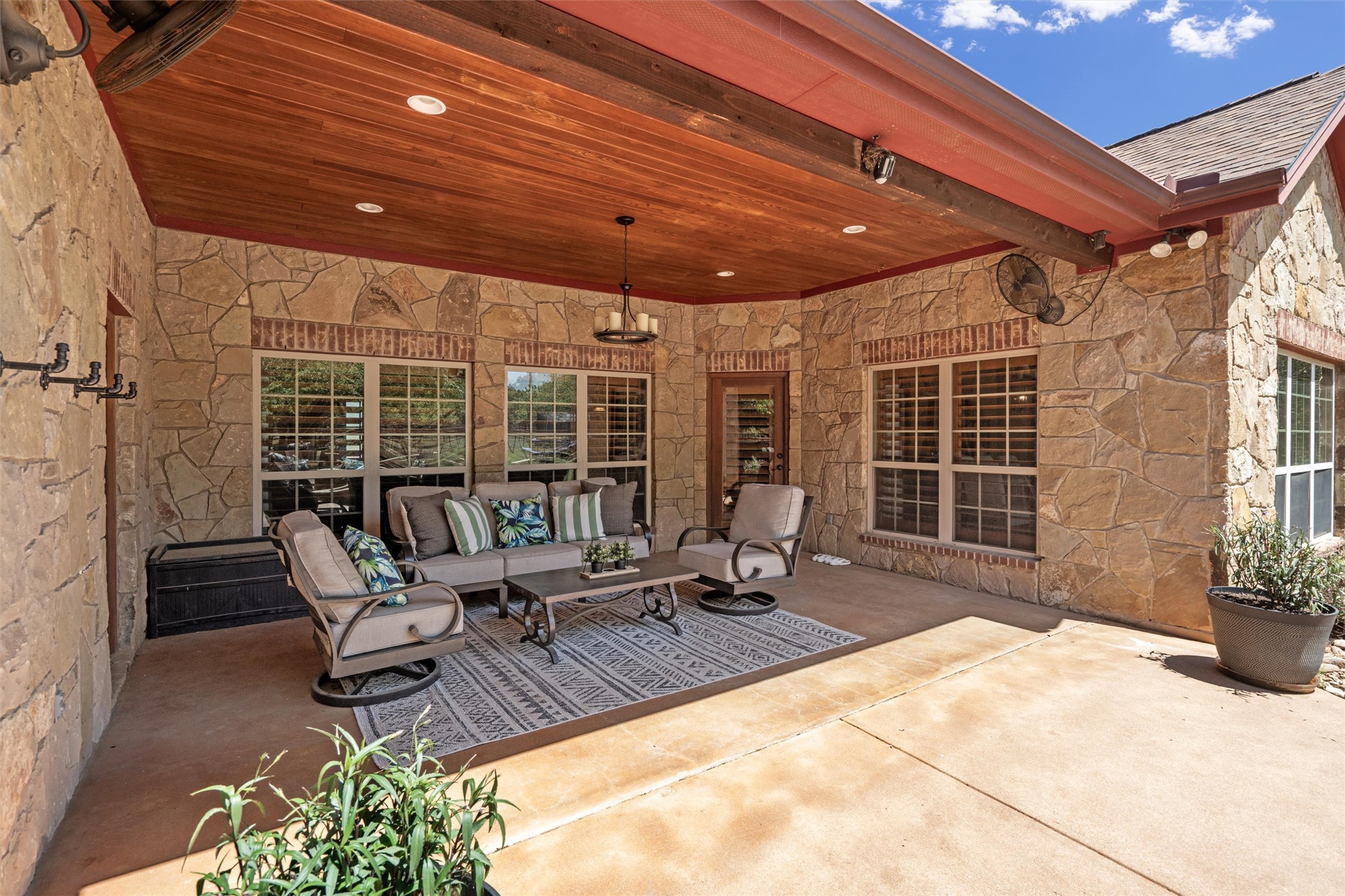 200 Little River Road Liberty Hill, TX 78642 - Photo 24 of 40 a building outdoor space with patio furniture and potted plants