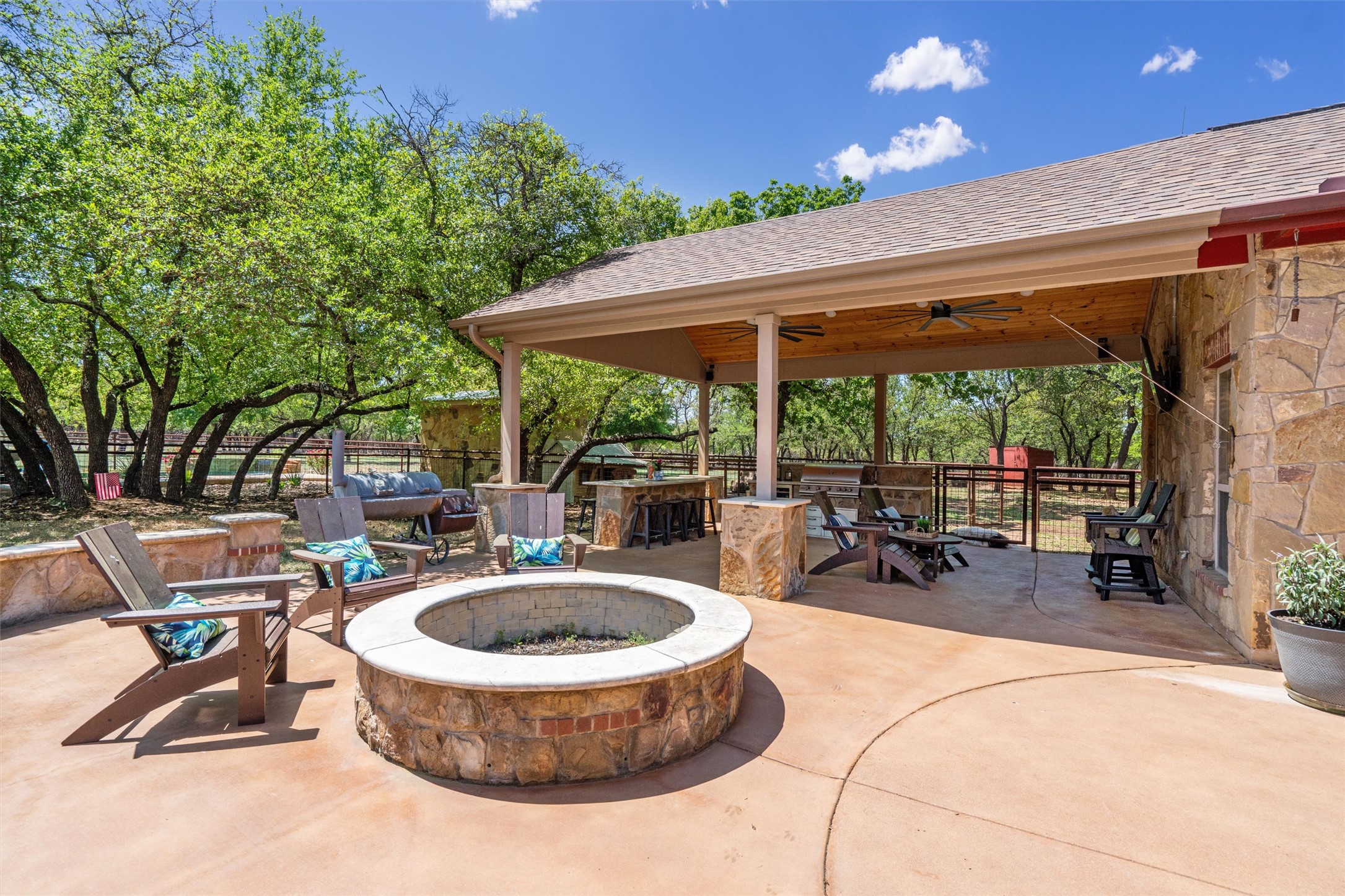 200 Little River Road Liberty Hill, TX 78642 - Photo 26 of 40 a view of patio with a table and chairs under an umbrella