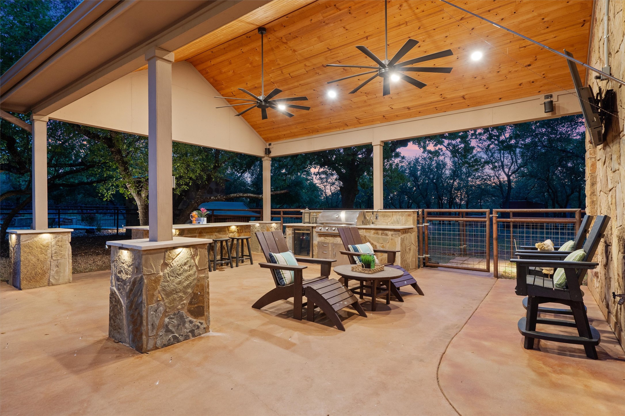 200 Little River Road Liberty Hill, TX 78642 - Photo 28 of 40 a view of a patio with a table chairs and a floor to ceiling window