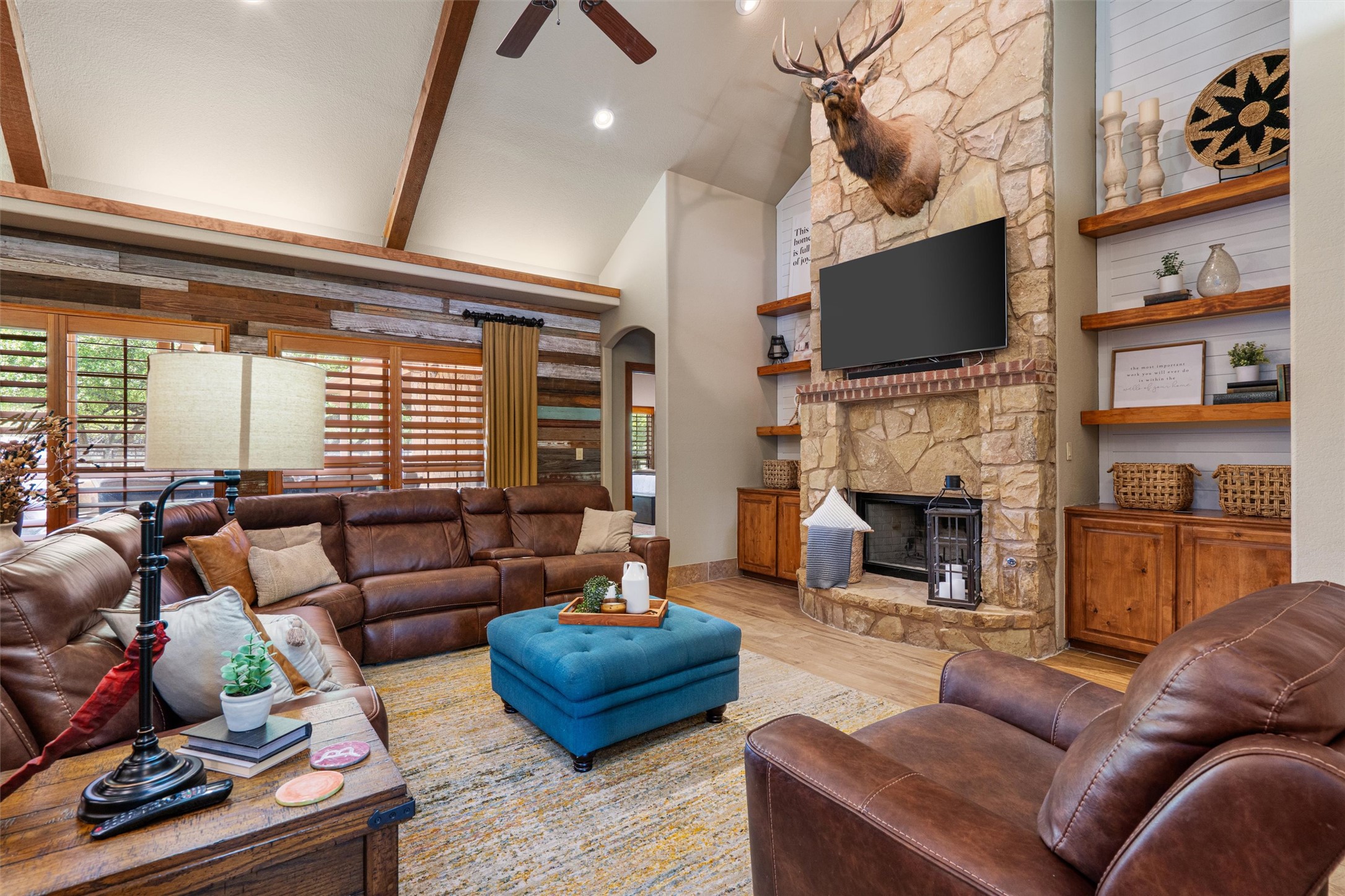 200 Little River Road Liberty Hill, TX 78642 - Photo 5 of 40 a living room with furniture fireplace and a flat screen tv