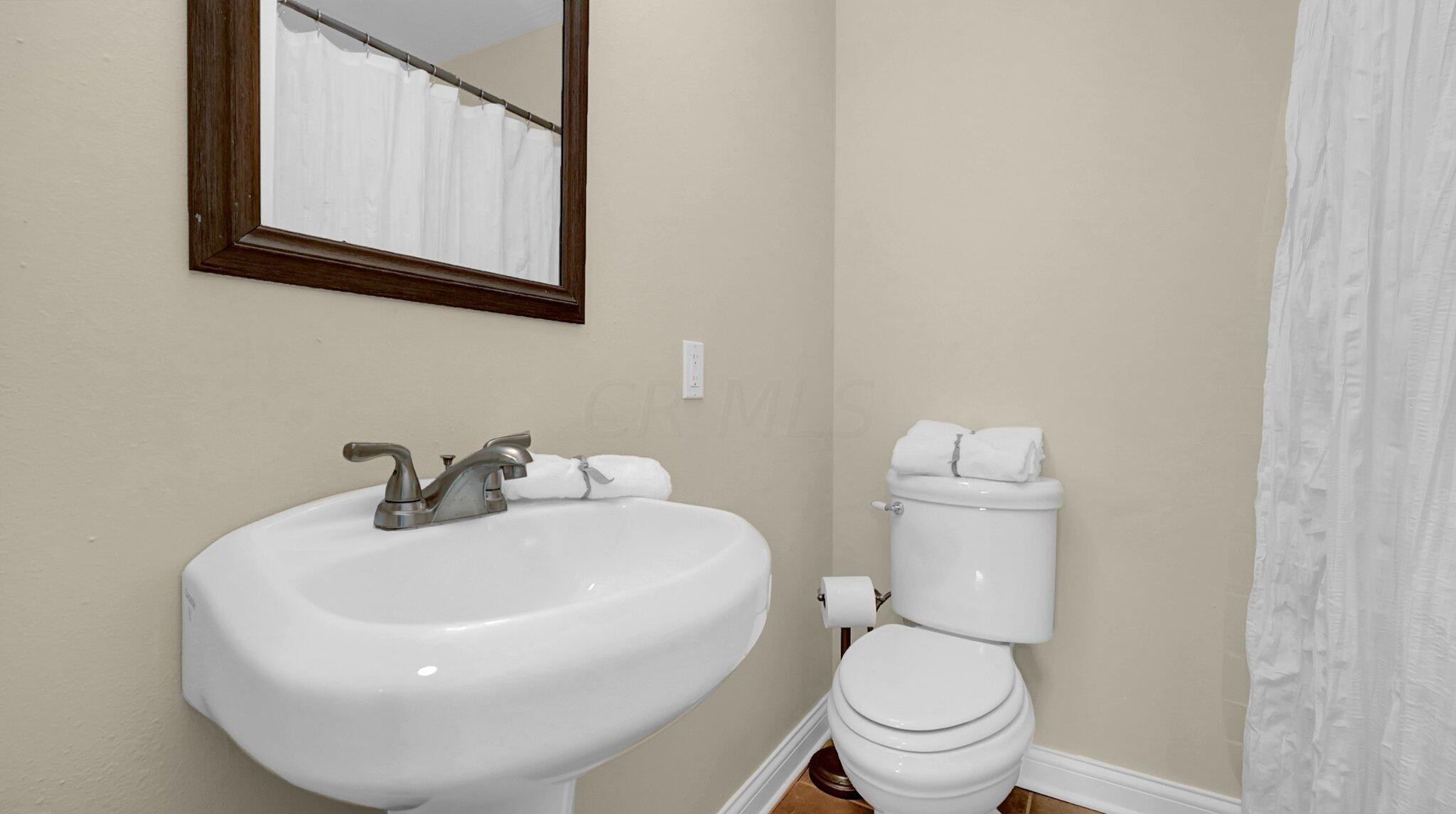 7790 Schott Road Westerville, OH 43081 - Photo 32 of 50 Lower level bathroom has a walk-in shower near the laundry room. Easy to come in wet from the pool, drop your towels in the laundry room, and head straight to the shower!