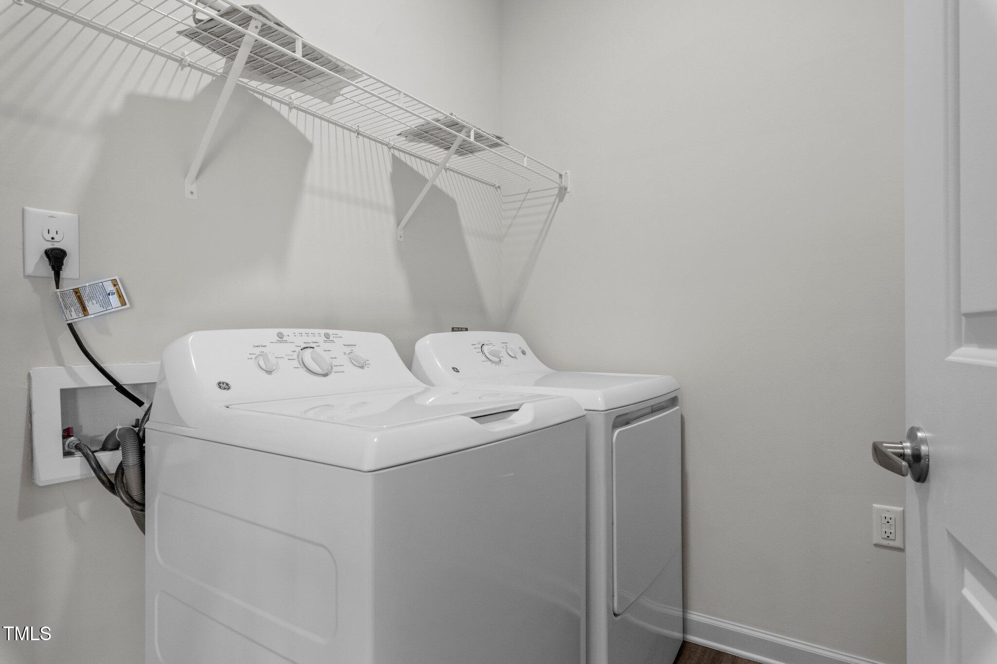 130 Grove Circle, Unit 204 Lillington, NC 27546 - Photo 13 of 28 a utility room with dryer and washer