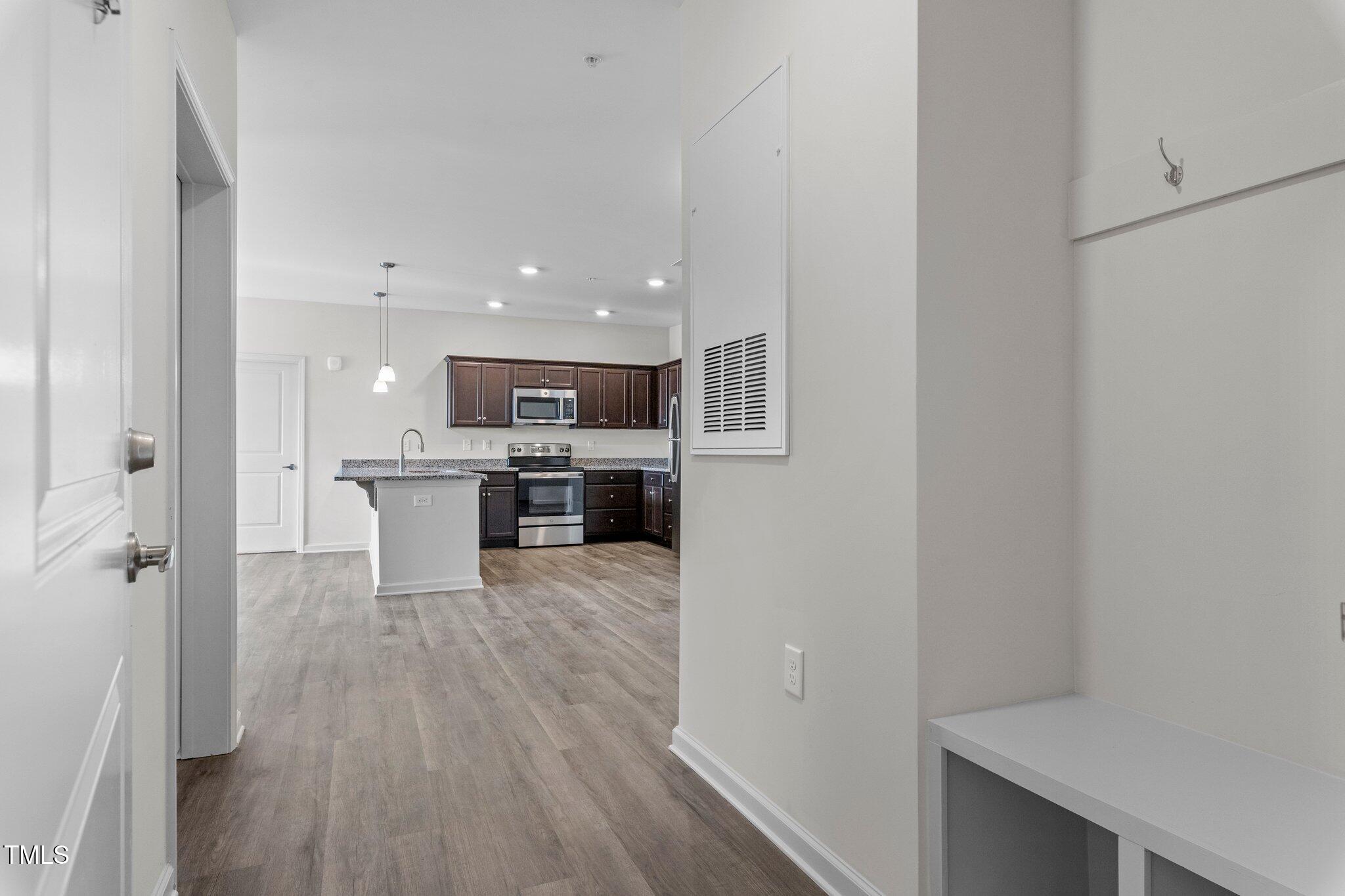 130 Grove Circle, Unit 204 Lillington, NC 27546 - Photo 4 of 28 a view of kitchen with wooden floor