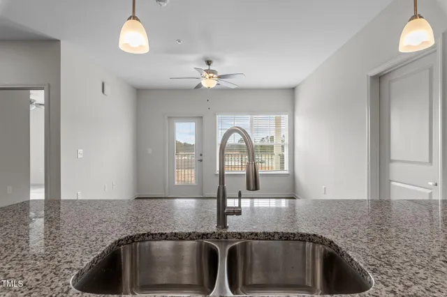 a kitchen with granite countertop a sink and granite counter tops