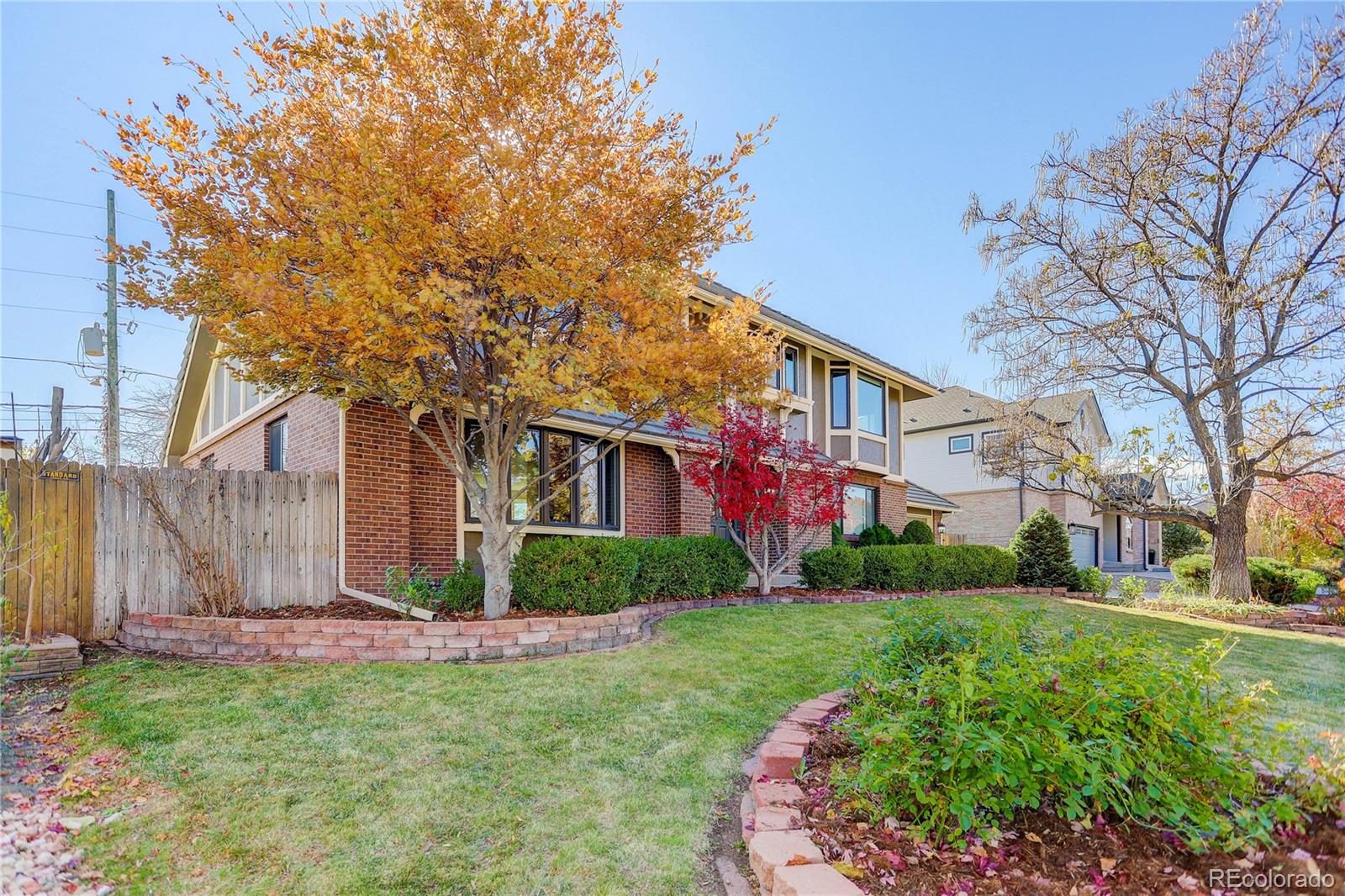 3804 Simms Street Wheat Ridge, CO 80033 - Photo 40 of 40 a front view of a house with garden