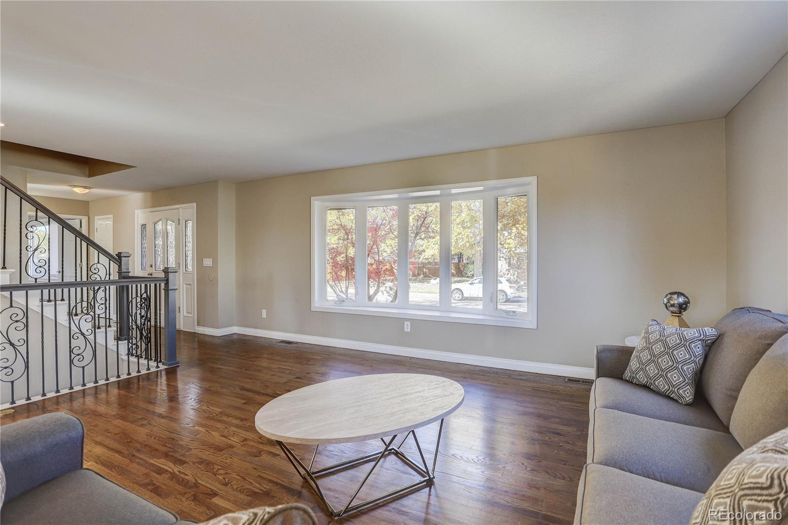 3804 Simms Street Wheat Ridge, CO 80033 - Photo 5 of 40 a living room with furniture and a window