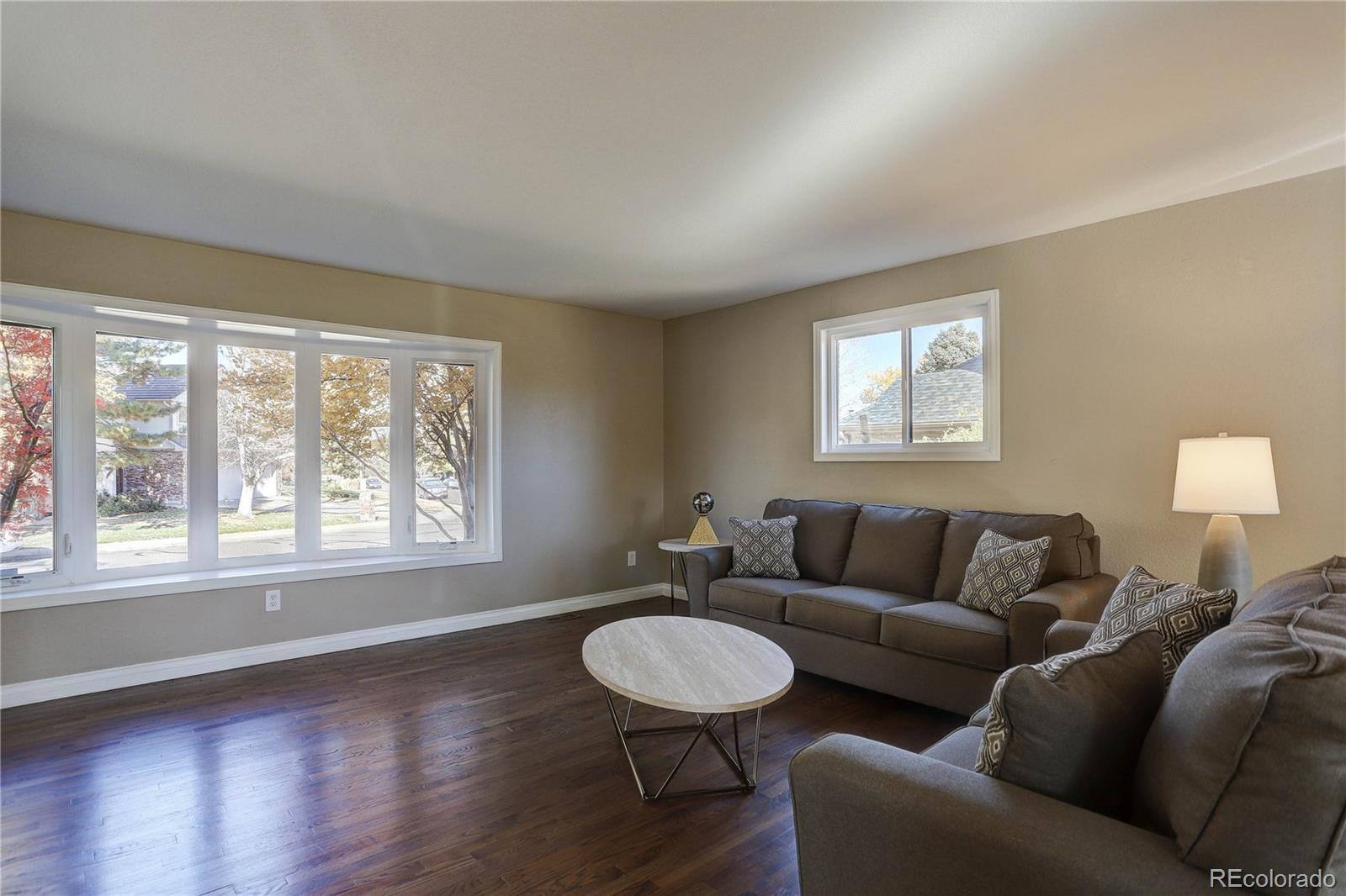 3804 Simms Street Wheat Ridge, CO 80033 - Photo 7 of 40 a living room with furniture and a window