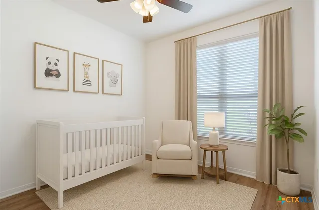 a bedroom with furniture and a window