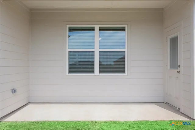 a view of backyard and porch