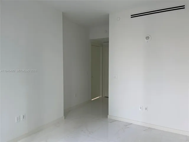 a bathroom with a double vanity sink toilet and a mirror