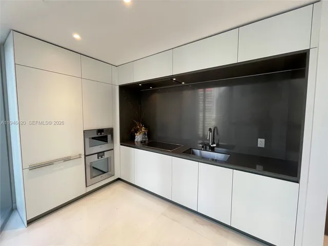 a view of swimming pool with outdoor seating and lake view