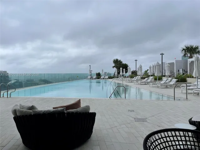 a view of a living room and kitchen