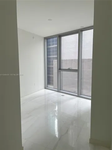 a city street filled with lots of tall buildings