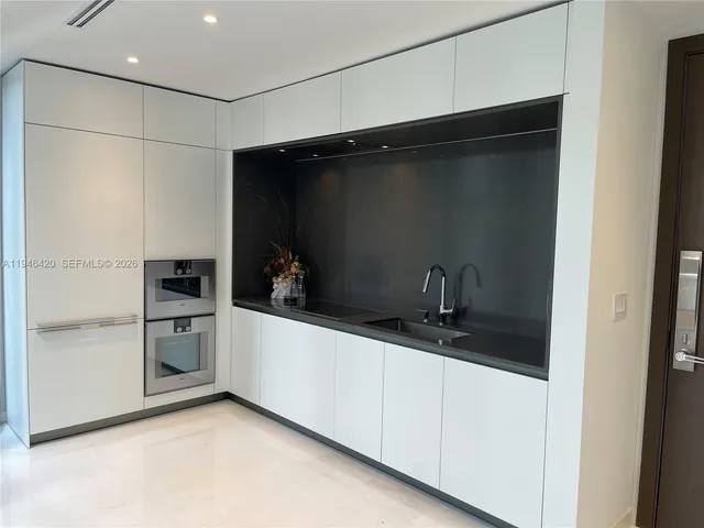 a view of hallway with windows