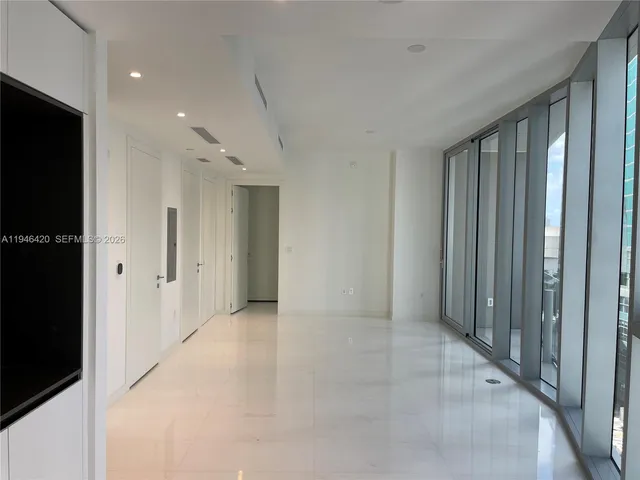 a front view of a house with a blue building