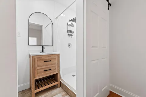a bathroom with a sink and a mirror