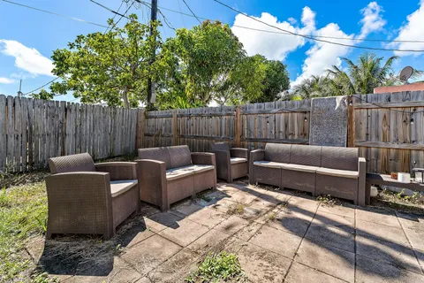 a view of a backyard with furniture