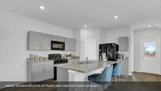a kitchen with a appliances and cabinets