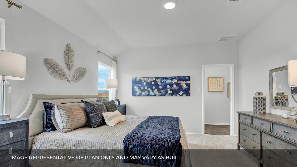 186 Morning Glory Loop Kyle, TX 78640 - Photo 15 of 21 a bedroom with a large bed and a chandelier