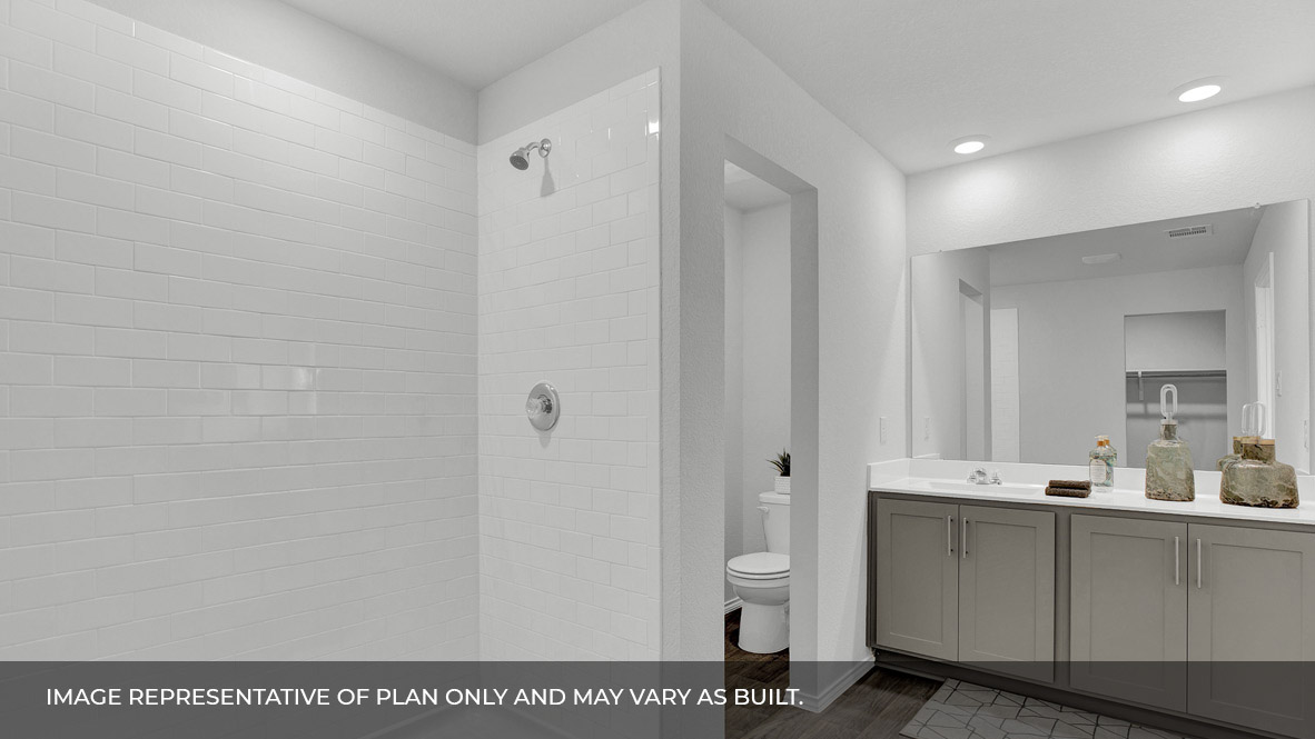 186 Morning Glory Loop Kyle, TX 78640 - Photo 16 of 21 a bathroom with a sink a toilet and a mirror