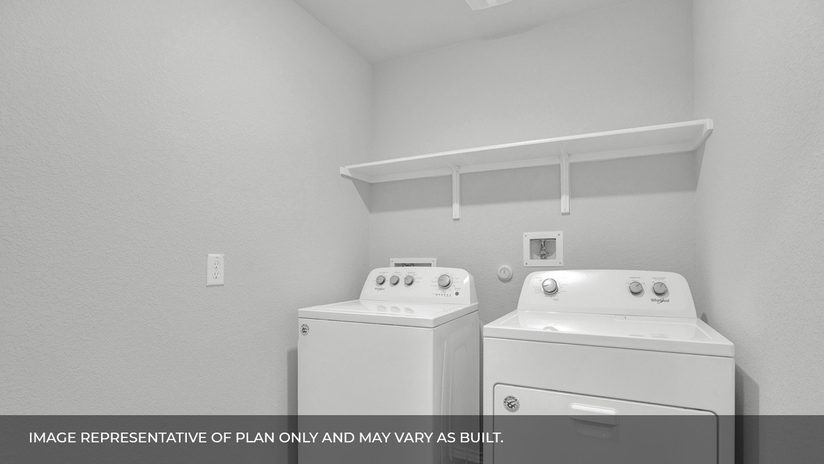 186 Morning Glory Loop Kyle, TX 78640 - Photo 5 of 21 a utility room with dryer and washer