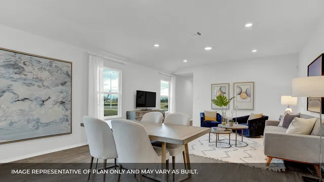 a living room with furniture a rug and a flat screen tv