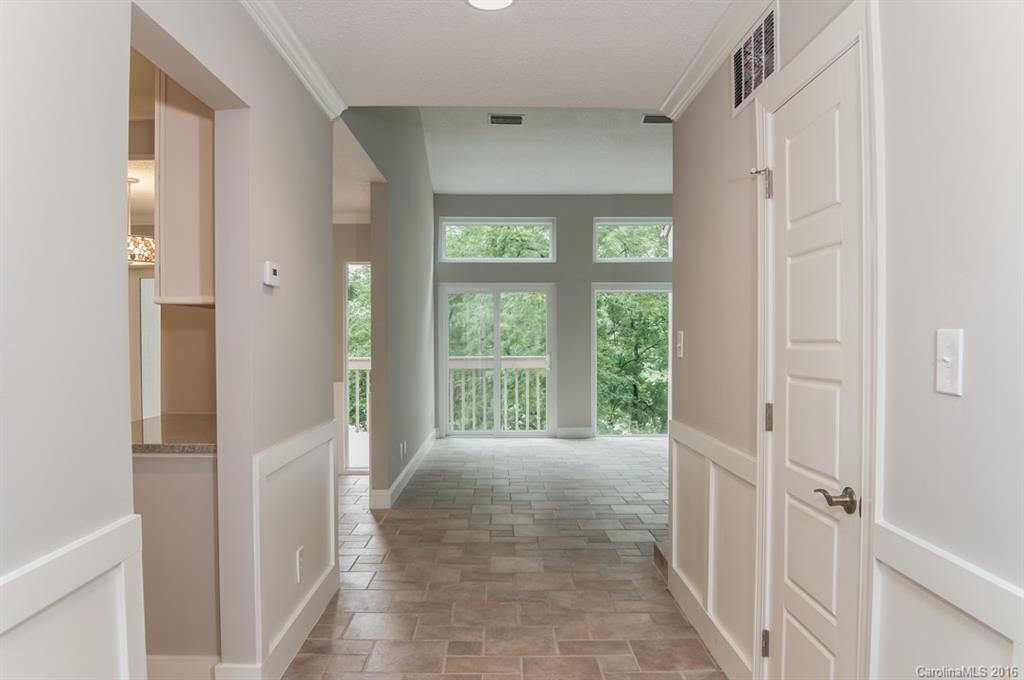 83 Ridgeport Road, Unit 83B Lake Wylie, SC 29710 - Photo 5 of 24 a view of a hallway with a window and wooden floor