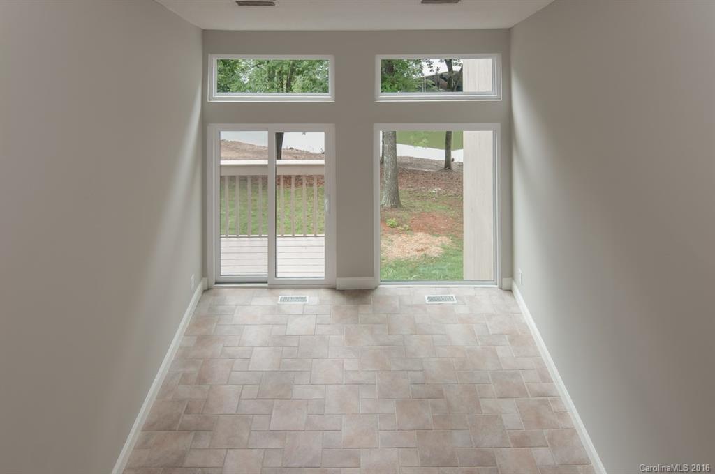 83 Ridgeport Road, Unit 83B Lake Wylie, SC 29710 - Photo 8 of 24 a view of an empty room with windows