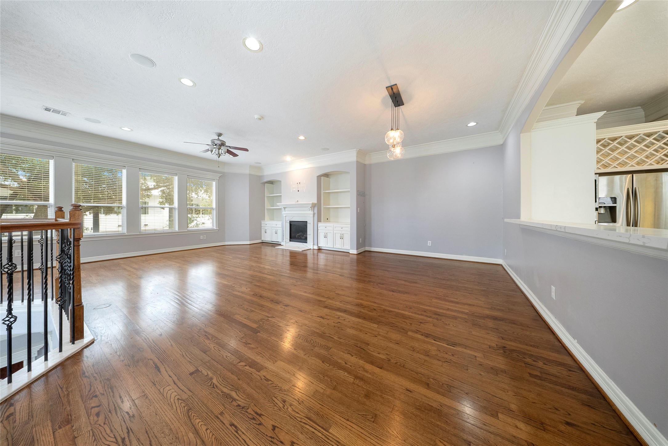 4216 Eli Street Houston, TX 77007 - Photo 5 of 25 an empty room with wooden floor and windows