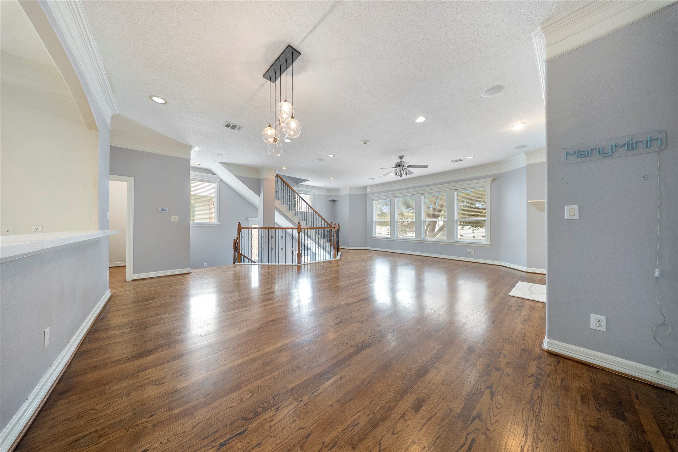 4216 Eli Street Houston, TX 77007 - Photo 8 of 25 a view of an empty room with wooden floor and a window
